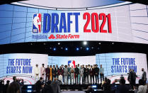 NBA Commissioner Adam Silver, center, poses for a photo with players projected to be first-round draft picks before the NBA basketball draft, Thursday, July 29, 2021, in New York. (AP Photo/Corey Sipkin)