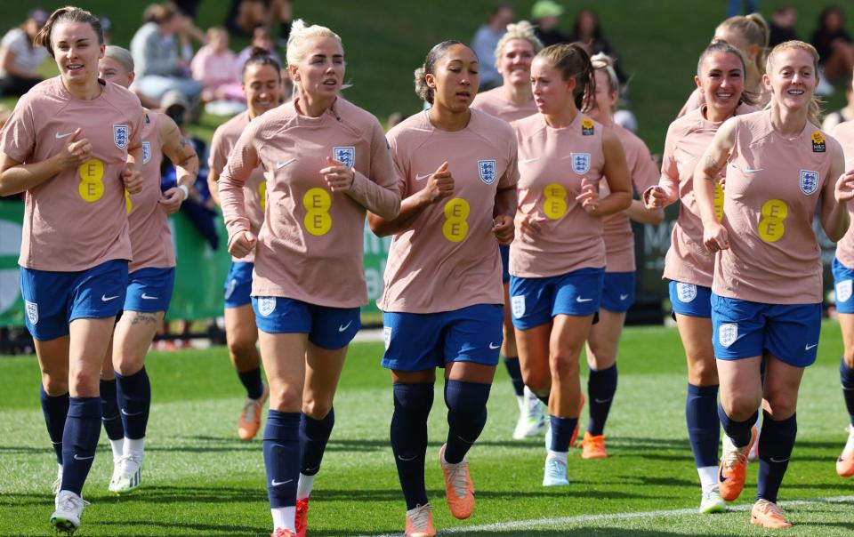 England players jog during an open training session at Sunshine Coast Stadium in Queensland