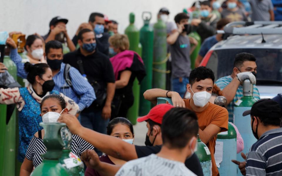 People wait for their turn to fill oxygen tanks in Guadalajara, Jalisco, Mexico - Francisco Guasco/EPA-EFE/Shutterstock