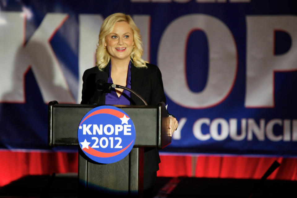 This image released by NBC shows Amy Poehler as Leslie Knope in a scene from "Parks and Recreation." Knope, a dedicated public servant in fictional Pawnee, Ind., used to be Deputy Parks Director, but at the end of last season, she won a seat on the Pawnee City Council. The high drama of this political season has been echoed by episodic TV like CBS' "The Good Wife," and Showtime's "Homeland" where character Nicholas Brody returns home after eight years' imprisonment in Afghanistan and becomes a U.S. Congressman. (AP Photo/NBC, Tyler Golden)