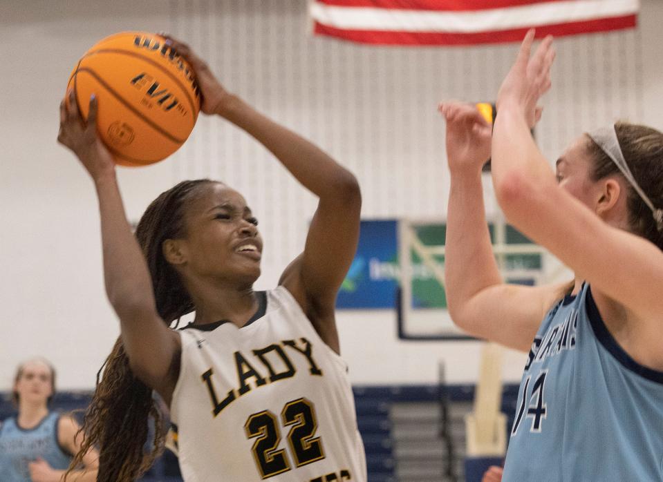 SJV Madison St. Rose works in towards the basket against Sparta Ally Sweeney. St. John Vianney Girls Basketball vs Sparta in NJSIAA Tournament of Champions Semifinals on March 18, 2022 in Toms River, NJ. 