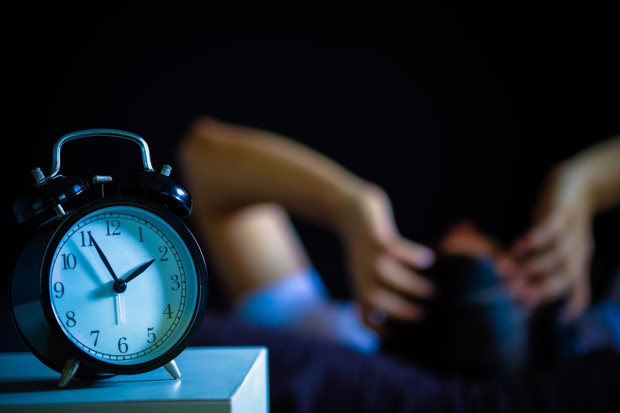 A man in bed suffering insomnia and sleep disorder. (Photo: Getty Images)