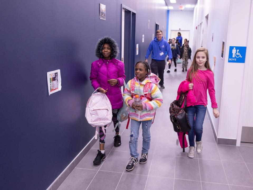 A group of kids enter the Boys & Girls Club of Massillon building following their classes at school. The center has about 1,000 youth members.