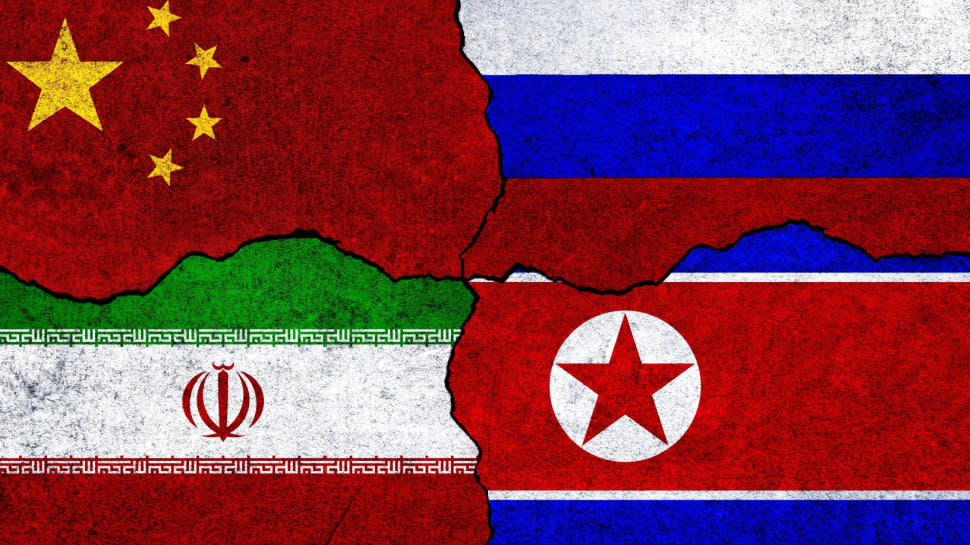  Flags of Iran, China, Russia and North Korea on a wall. China North Korea Iran Russia alliance. 