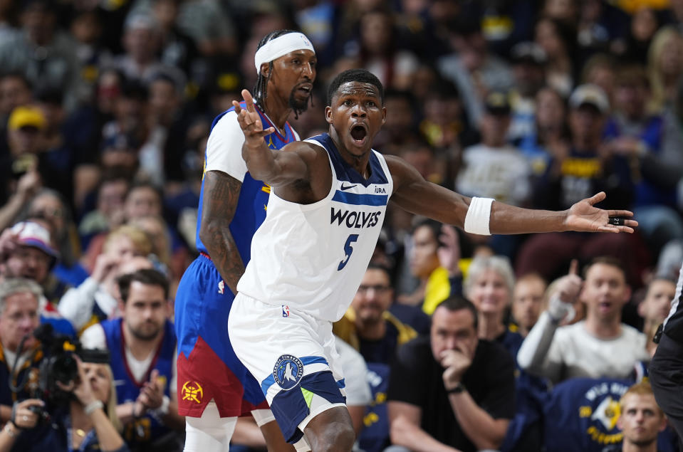 Minnesota Timberwolves guard Anthony Edwards (5) reacts after not getting a call as Denver Nuggets guard Kentavious Caldwell-Pope, left, looks on in the first half of Game 1 of an NBA basketball second-round playoff series Saturday, May 4, 2024, in Denver. (AP Photo/David Zalubowski)