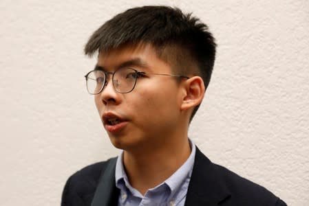 Hong Kong's pro-democracy activist Joshua Wong speaks to a reporter after a panel discussion on Anti-Extradition Law Movement in Hong Kong at Columbia University Law School in New York City