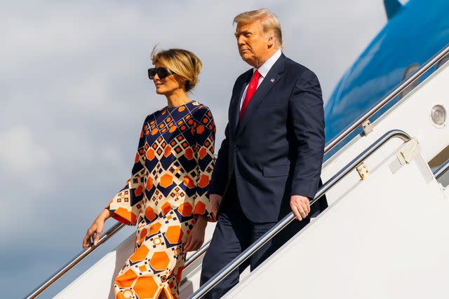 Manuel Balce Ceneta/AP/Shutterstock Melania and Donald Trump disembark from their final flight on Air Force One in West Palm Bleach, Florida, on Jan. 20, 2021