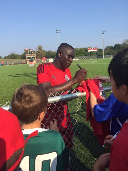 Buba Jobe signs autographs after practice. (Courtesy of Gemmell family) 