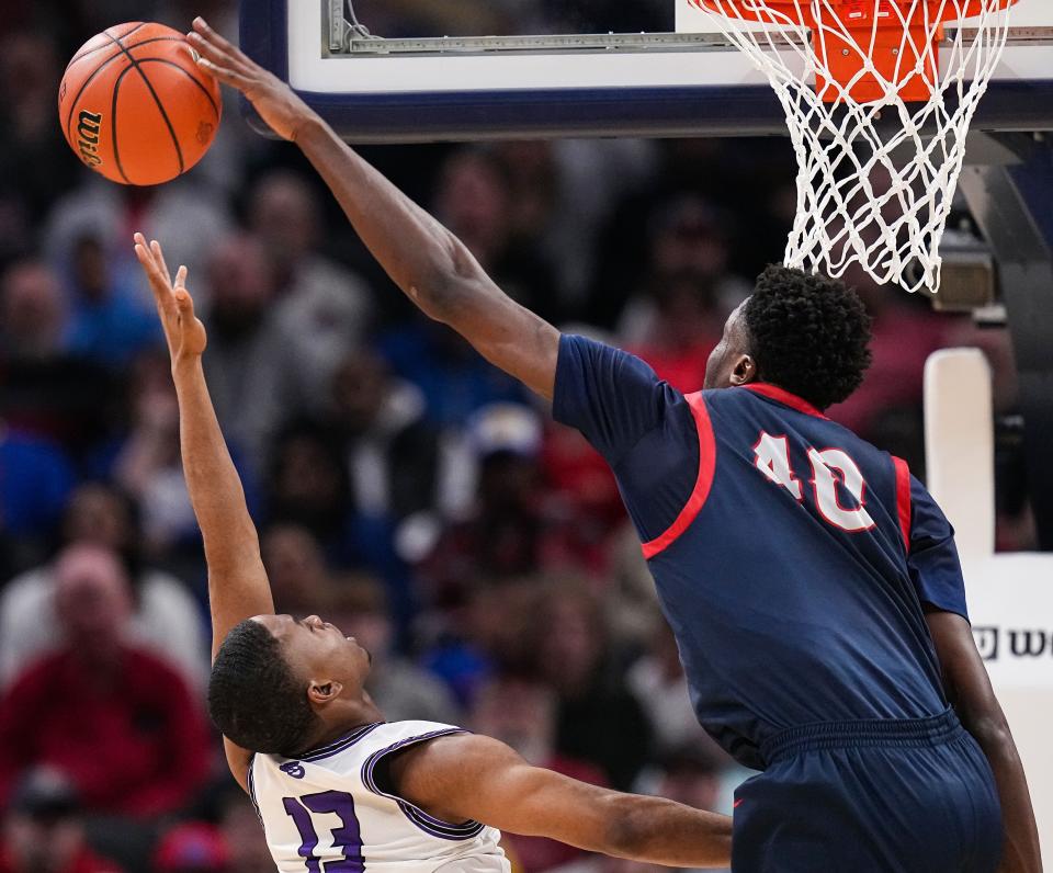 Ben Davis Giants Clay Butler III (13) attempts a lay-up against Kokomo Wildkats center Flory Bidunga (40) on Saturday, March 25, 2023 at Gainbridge Fieldhouse in Indianapolis. The Ben Davis Giants defeated the Kokomo Wildkats, 53-41, for the IHSAA Class 4A state finals championship. 