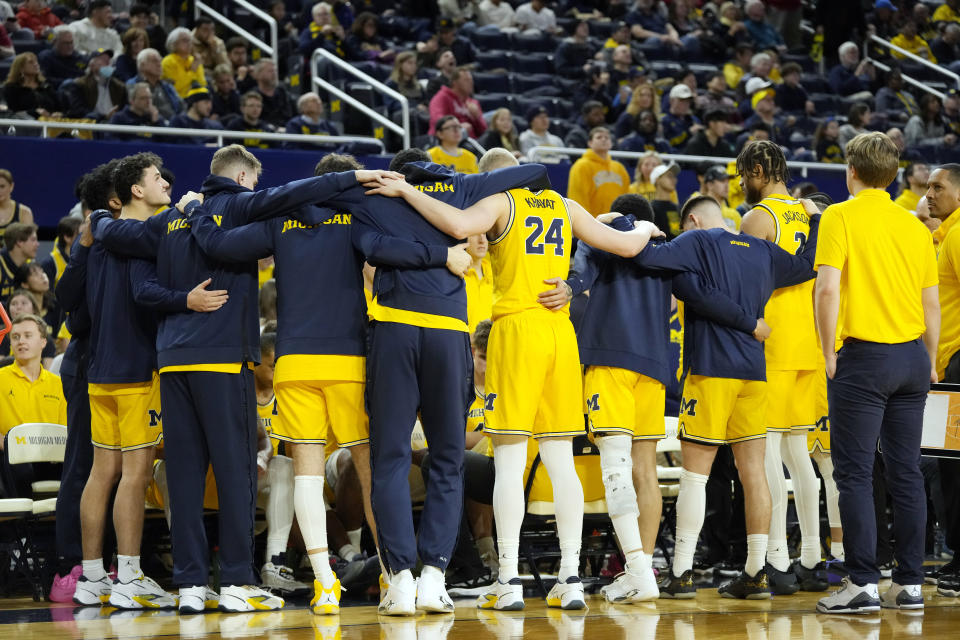 The Michigan team meets on the sideline during the second half of an NCAA college basketball game against Nebraska, Sunday, March 10, 2024, in Ann Arbor, Mich. (AP Photo/Carlos Osorio)