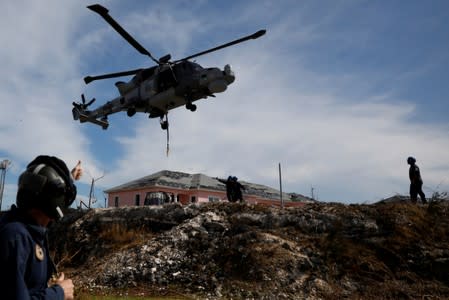 A Royal Navy helicopter takes off outside Marsh Harbour Healthcare Center after Hurricane Dorian hit the Abaco Islands in Marsh Harbour