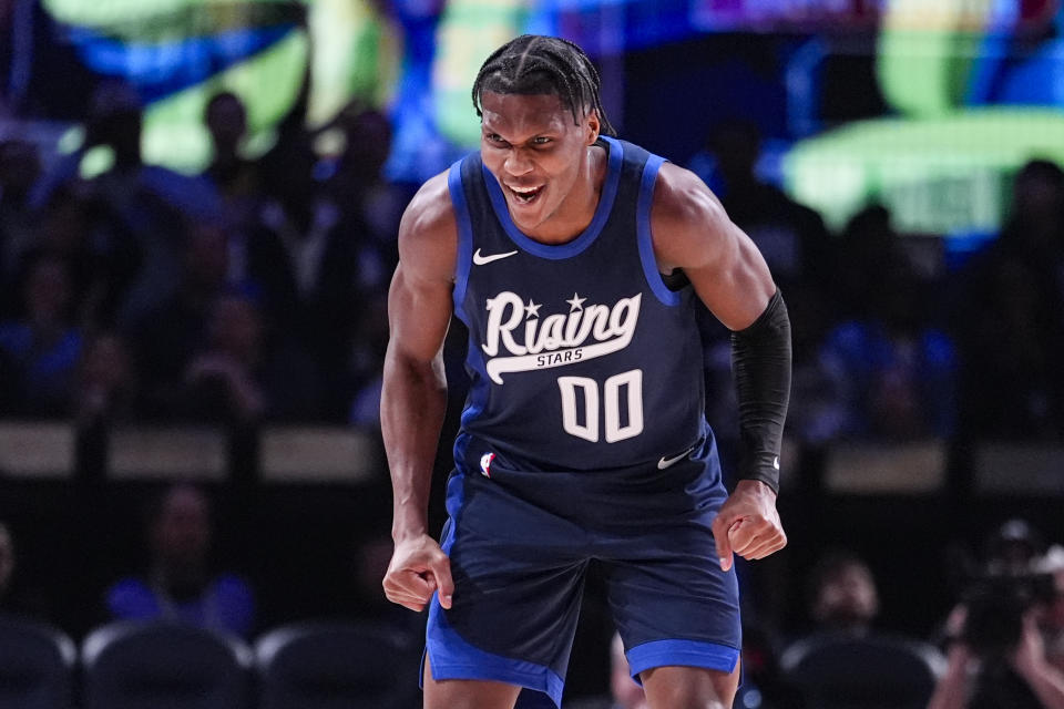 Bennedict Mathurin of the Indiana Pacers celebrates after a 3-point basket during an NBA Rising Stars basketball game in Indianapolis, Friday, Feb. 16, 2024. (AP Photo/Michael Conroy)