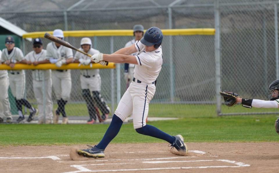 Central Catholic’s TP Wentworth swings at a pitch during a Valley Oak League matchup with Manteca at Manteca High School on Friday, April 26, 2024.