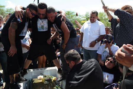 Family and friends attend the funeral of Angel Candelario, one of the victims of the shooting at the Pulse night club in Orlando, at his hometown of Guanica, Puerto Rico, June 18, 2016. REUTERS/Alvin Baez