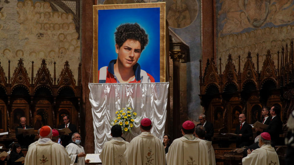 An image of 15-year-old Carlo Acutis, an Italian boy who died in 2006 of leukemia, is unveiled during his beatification ceremony celebrated by Cardinal Agostino Vallini in the St. Francis Basilica, in Assisi, Italy, Oct. 10, 2020.