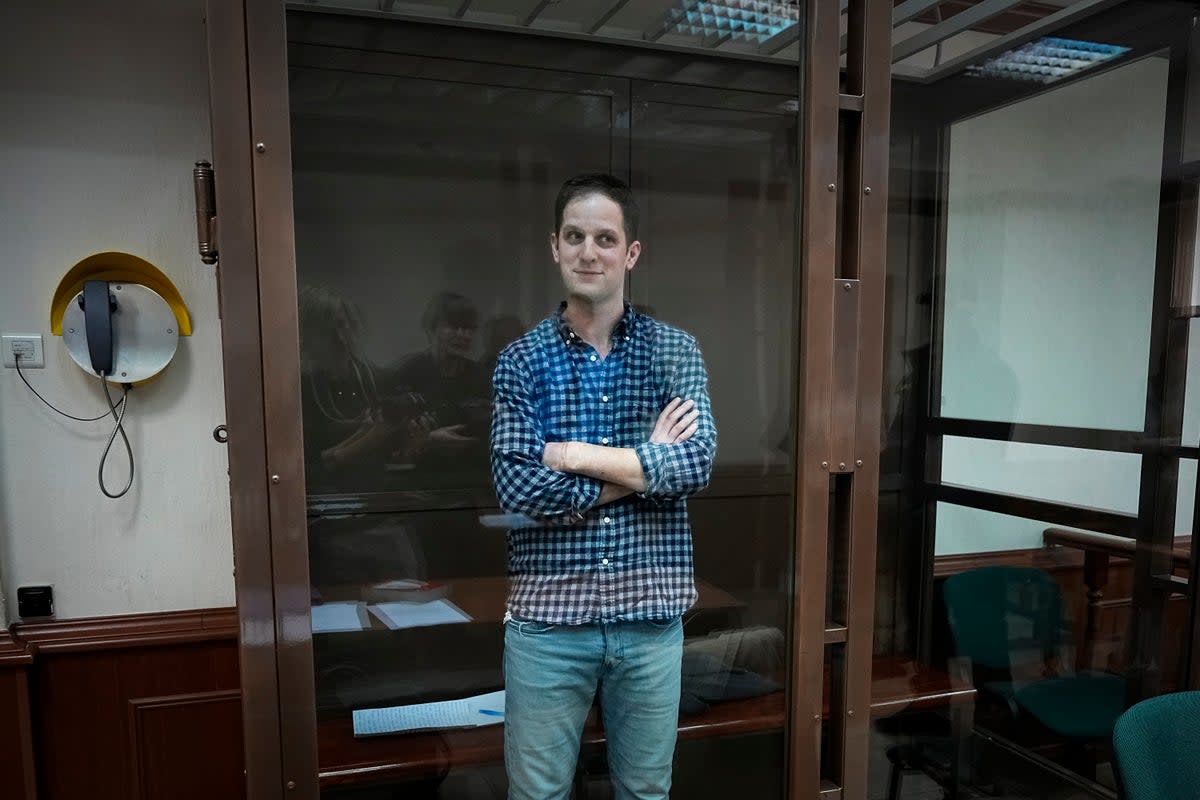 Wall Street Journal reporter Evan Gershkovich stands in a glass cage in a courtroom at the Moscow City Court, in Moscow, Russia, on Tuesday, April 18, 2023 (AP)