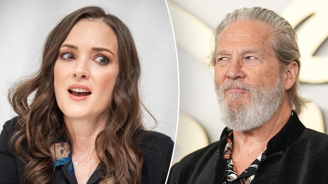 Winona Ryder tilts her head a bit and looks a bit shocked during a conference split Jeff Bridges in a black suit looks to his right on the carpet begrudgingly