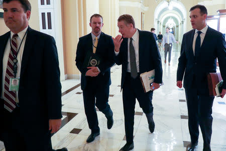 FILE PHOTO: U.S. Trade Representative Robert Lighthizer speaks to an aide after he leaves a meeting with House Speaker Nancy Pelosi at the U.S. Capitol in Washington, U.S., May 15, 2019. REUTERS/Jonathan Ernst/File Photo