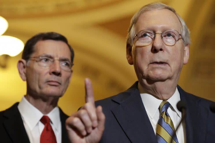 Senate Majority Leader Mitch McConnell of Ky., right, accompanied by Sen. John Barrasso, R-Wyo., meets with reporters on Capitol Hill in Washington, Tuesday, May 23, 2017, following after a Republican policy luncheon. (Photo: Jacquelyn Martin/AP)