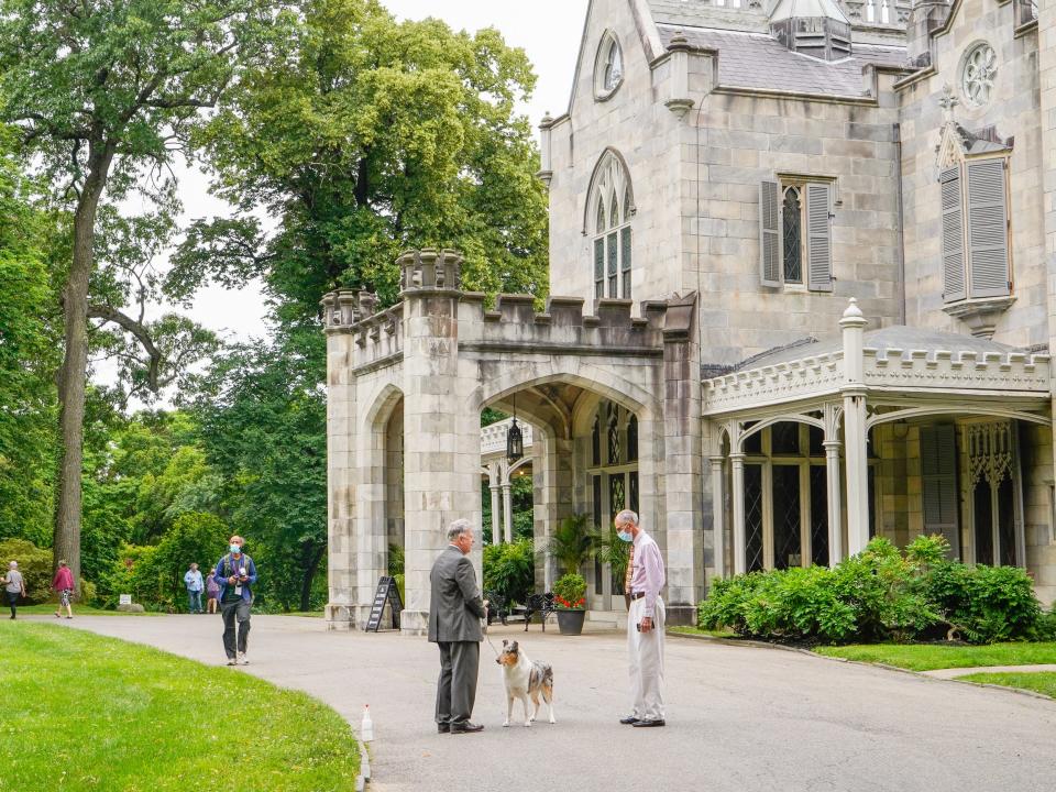 Lyndhurst Mansion exterior with people and dog