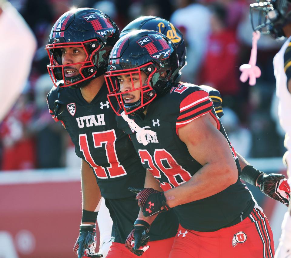 Utah Utes safety Sione Vaki (28) celebrates his touchdown with Utah Utes wide receiver Devaughn Vele (17) against the California Golden Bears in Salt Lake City on Saturday, Oct. 14, 2023. Utah won 34-14. | Jeffrey D. Allred, Deseret News