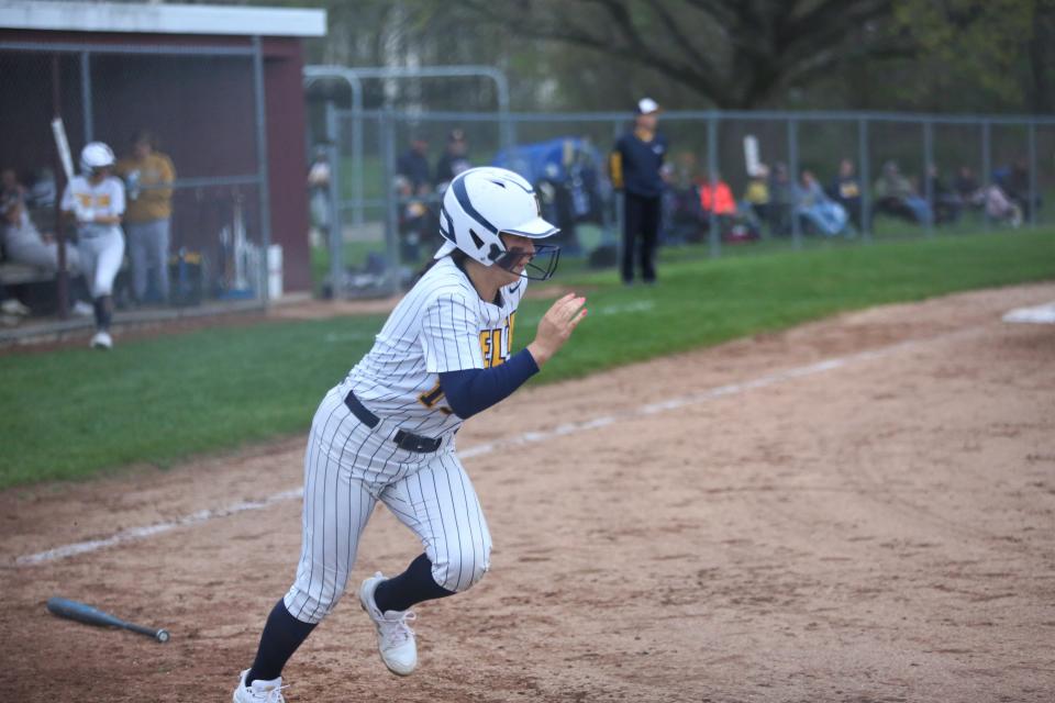 Delta senior Kate Penrod runs to first base against Yorktown in the first round of the 2022 Delaware County softball tournament at Wes-Del High School on Wednesday, May 4, 2022.