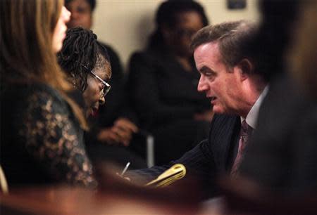 Defense witness Katherine Stinney-Robinson (L) talks with defense lawyer Steven McKenzie at the hearing to reopen the case for her brother George Stinney Jr. in Sumter, South Carolina January 21, 2014. REUTERS/Randall Hill