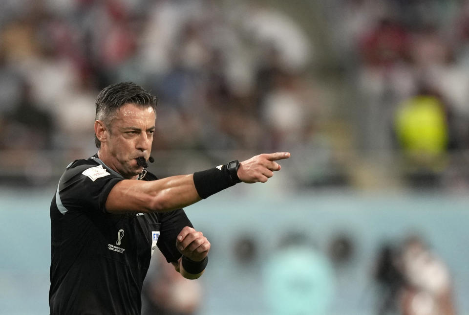 Referee Raphael Claus gives directions during the World Cup group B soccer match between England and Iran at the Khalifa International Stadium in Doha, Qatar, Monday, Nov. 21, 2022. (AP Photo/Frank Augstein)