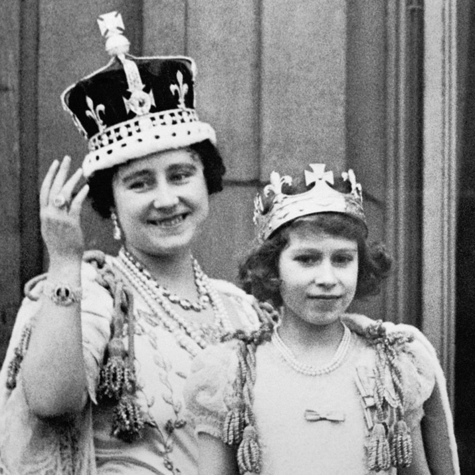 Queen Elizabeth (the Queen Mother) with her eldest daughter on the balcony of Buckingham Palace, after the coronation of King George VI in May, 1937 (PA)