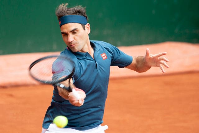 Roger Federer hits a forehand during his defeat by Pablo Andujar 