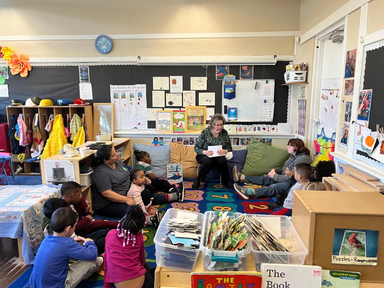 Phyllis Wezeman, center, gives a presentation about her book "Petra's Pier Picnic" at El Campito Child Development Center in South Bend. The author and Mishawaka resident has been visiting local classrooms and giving away copies of the book, which is about combating hunger, in memory of Sarah Proctor, a local teacher who died Dec. 2, 2022, in a car accident.