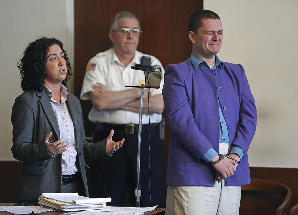 Kevin Edson cries during a hearing as he stands beside his attorney, Shannon Lopez, left, in Municipal Court Wednesday, May 7, 2014 in Boston. Edson, accused of a bomb hoax near the Boston Marathon finish line on the anniversary of the 2013 bombing anniversary, was found mentally competent for trial after being evaluated at a state hospital following his April 15 arrest. (AP Photo/Boston Herald, John Wilcox, Pool)