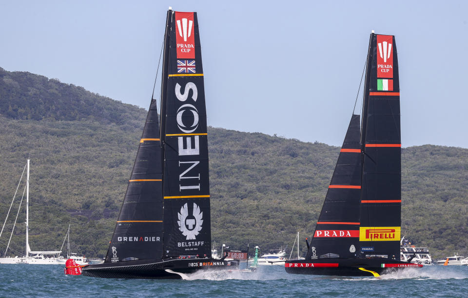 Britain's INEOS Team UK, left, and Italy's Luna Rossa in race seven of the Prada Cup on Auckland's Waitemata Harbour, New Zealand, Sunday, Feb. 21, 2021. (Brett Phibbs/NZ Herald via AP)