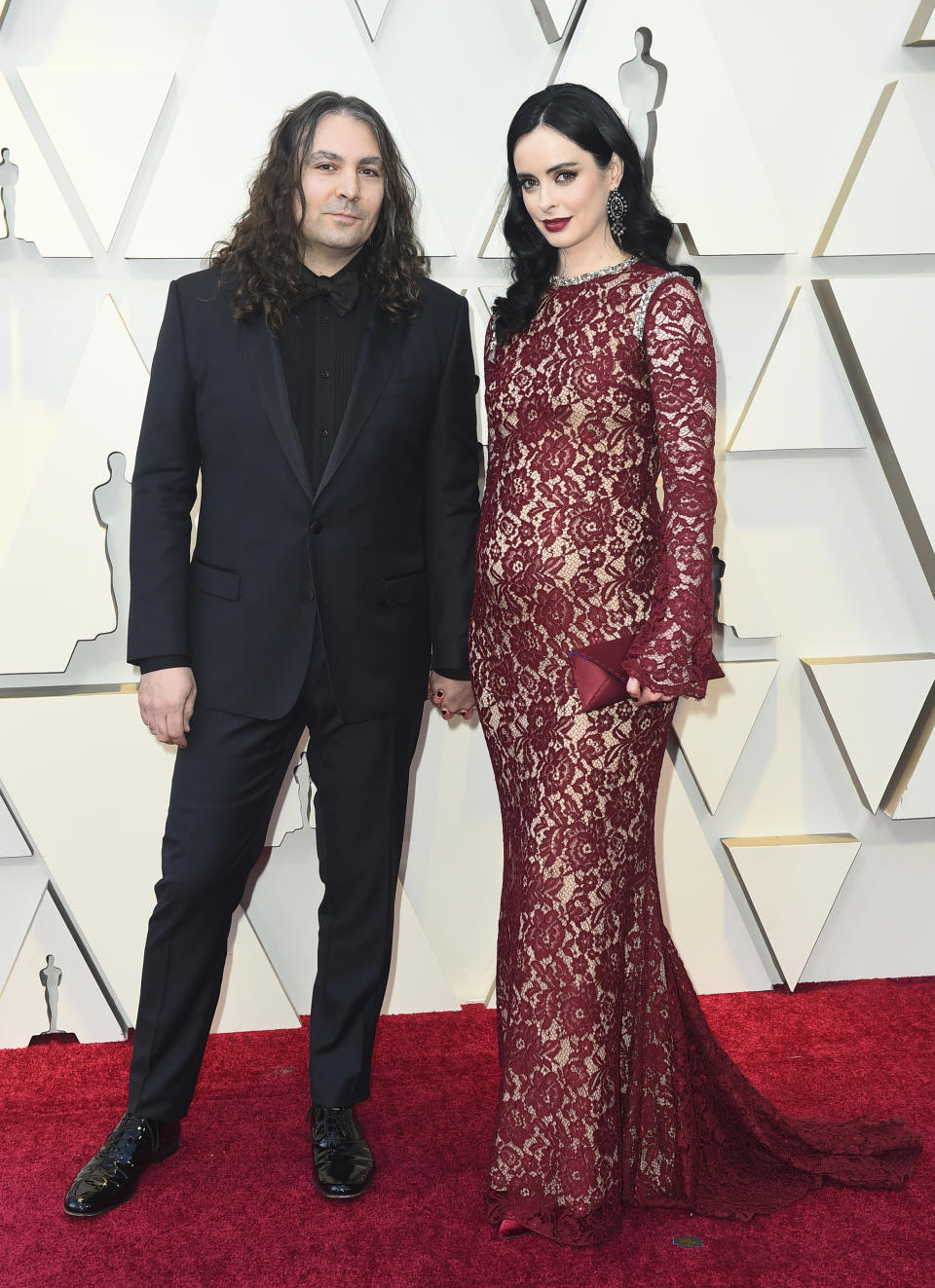 <p>The actress showed off her bump in a Reem Acra dress.</p>