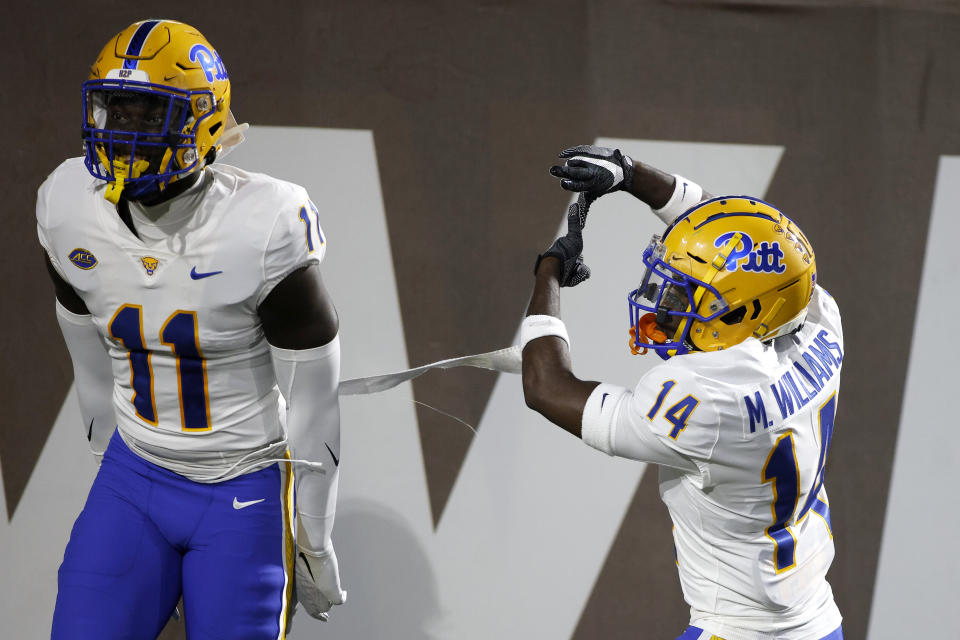 Pittsburgh's Marquis Williams, right, and Bangally Kamara (11) celebrate Williams' touchdown on an interception against Western Michigan during the first half of an NCAA college football game, Saturday, Sept. 17, 2022, in Kalamazoo, Mich. (AP Photo/Al Goldis)