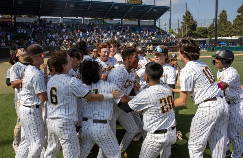 Long Beach, CA - May 20: Crespi celebrates their 7th inning walkoff win against South Hills in CIF division 2 finals at Blair Field on Saturday, May 20, 2023 in Long Beach, CA. (Brian van der Brug / {cred