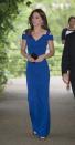 <p>A royal blue gown was a fitting choice for the Duchess at a Kensington Palace gala. Designed by Roland Mouret, the fitted dress featured cut-out shoulders and was worn with Cartier hoops, a satin Prada clutch and Gianvito Rossi sandals. <i>[Photo: PA]</i> </p>