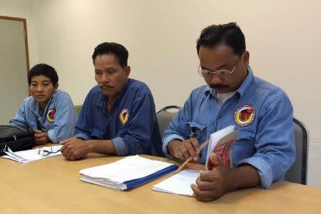 Nathaphan Saengthub, Prateep Rakangthong and Pianrat Bunrit (L-R) of the Southern Peasants Federation of Thailand (SPFT) meet with their lawyer in the office of Thailand's National Human Rights Commission in Bangkok, Thailand May 19, 2016. REUTERS/Alisa Tang