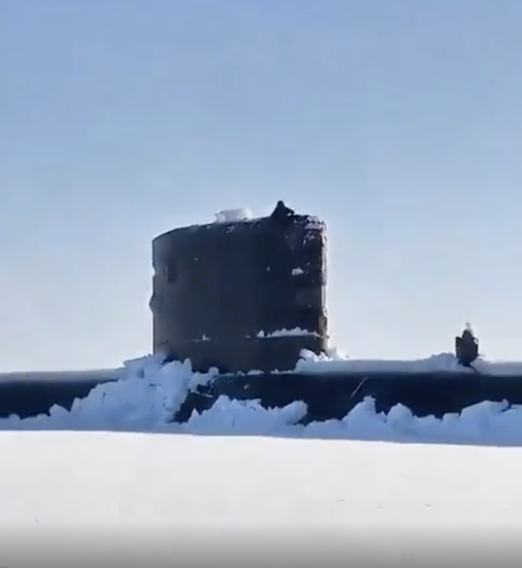 Close-up of a submarine emerging from snow