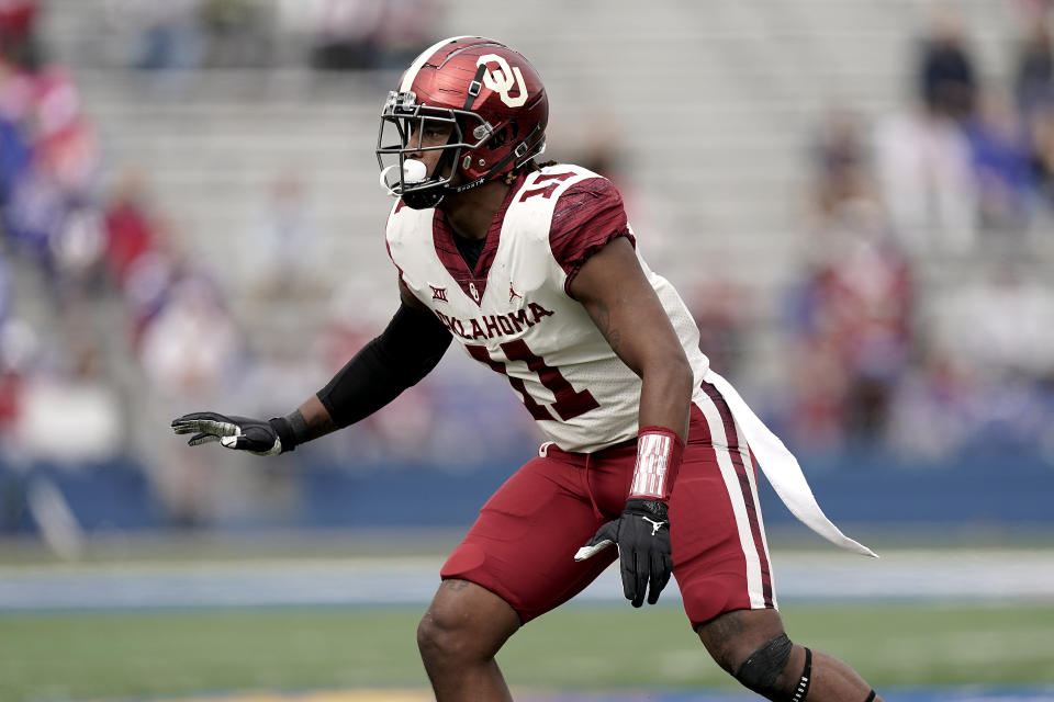 FILE - Oklahoma linebacker Nik Bonitto runs during the second half of the team's NCAA college football game against Kansas on Oct. 23, 2021, in Lawrence, Kan. Bonitto was selected by the Denver Broncos during the second round of the NFL draft Friday, April 29. (AP Photo/Charlie Riedel, File)