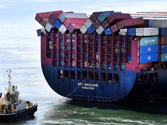 Fallen shipping containers are seen on the container ship APL England as it docks in Brisbane (AAP Image/Dan Peled via REUTERS)