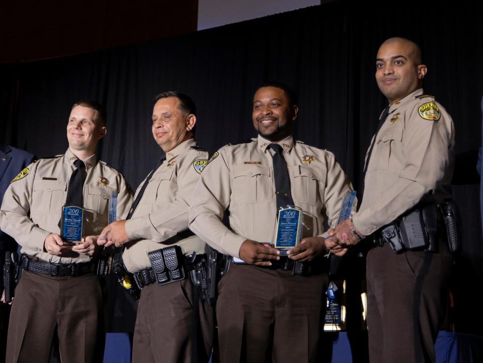 From left to right, Deputy Bradley Murrell, Craig Butt, James Flowers and Omar Fernandez accepts the Life Saving Award at the 200 club's annual Chris Argentinis Valor Award Ceremony at the Savannah Convention Center in Savannah, GA on Tuesday, October 10, 2023.