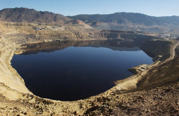 Berkeley Pit, an open-pit copper mine that has been allowed to fill with water since its closure in 1982, is seen in this October, 2003 file photo.