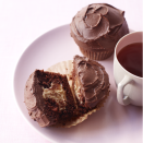 <p>Use a pastry bag to easily pipe the luscious peanut butter filling to simple chocolate cupcakes. The chocolate sour cream frosting is a must!</p><p><em><a href="https://www.goodhousekeeping.com/food-recipes/a13332/peanut-butter-chocolate-cupcakes-recipe-122602/" rel="nofollow noopener" target="_blank" data-ylk="slk:Get the recipe for Peanut Butter and Chocolate Cupcakes »;elm:context_link;itc:0;sec:content-canvas" class="link ">Get the recipe for Peanut Butter and Chocolate Cupcakes »</a></em> </p>