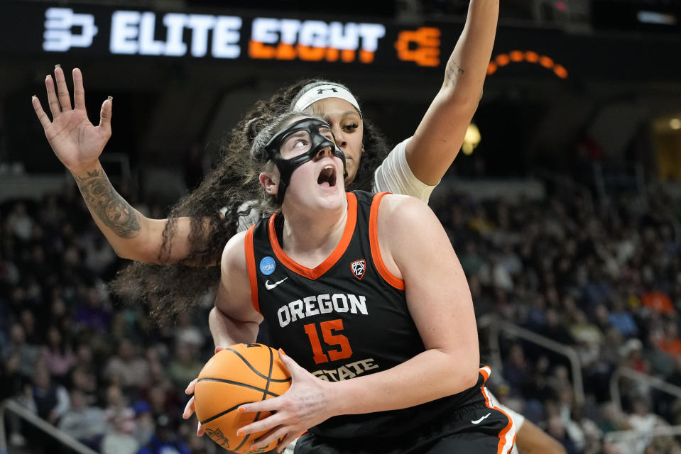 Oregon State forward Raegan Beers (15) goes up for a shot against South Carolina center Kamilla Cardoso (10) during the fourth quarter of an Elite Eight round college basketball game during the NCAA Tournament, Sunday, March 31, 2024, in Albany, N.Y. (AP Photo/Mary Altaffer)