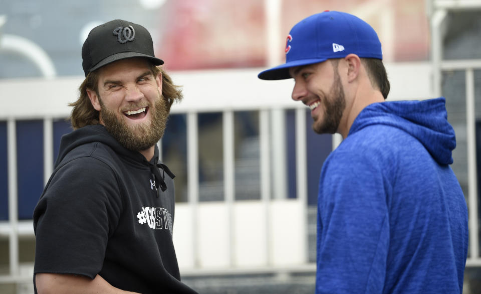 Bryce Harper and Kris Bryant are good friends off and on the field. (AP Photo/Nick Wass)