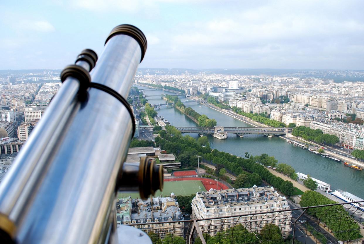 A purely scenic photograph captured from one of the observatory levels atop the Eiffel Tower.