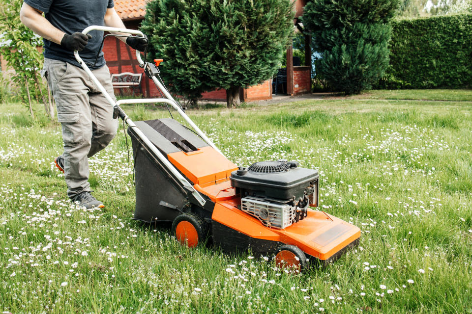 A man mowing his lawn