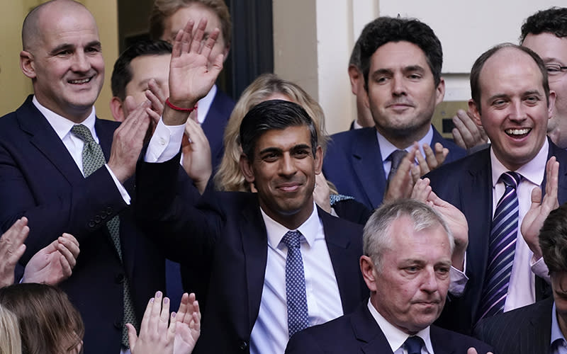 Rishi Sunak waves after winning the Conservative Party leadership contest