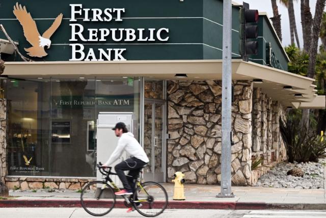 A man rides a bicycle past the First Republic Bank branch in Santa Monica, California.